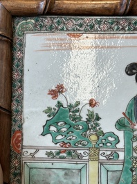 A rectangular Chinese famille verte plaque in a wooden faux bamboo frame, Kangxi