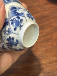 Four Chinese blue and white saucers and an 'erotic' cup, Kangxi