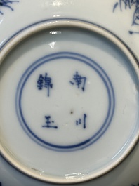 Four Chinese blue and white saucers and an 'erotic' cup, Kangxi