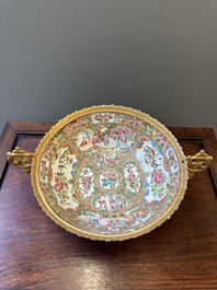 A Chinese Canton famille rose reticulated basket on stand and a bowl with gilt bronze mounts, 19th C.