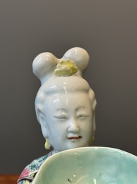 A Chinese famille rose figure of a lady with a bowl, Yongzheng