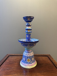 A large Chinese Canton enamel blue-ground 'shou' candlestick, Qianlong/Jiaqing