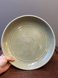 A Chinese Longquan celadon dish with floral anhua design, Ming