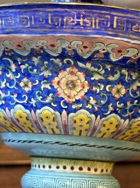A large Chinese Canton enamel blue-ground 'shou' candlestick, Qianlong/Jiaqing