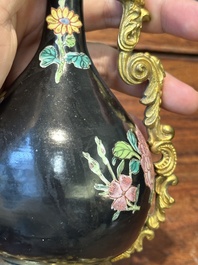 A pair of Chinese black-ground famille rose vases with gilt bronze mounts, Yongzheng