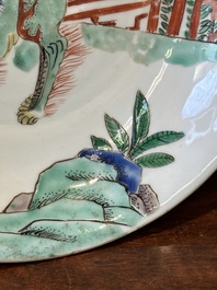 A Chinese famille verte 'qilin and falcon' plate, artemisia leaf mark, Kangxi
