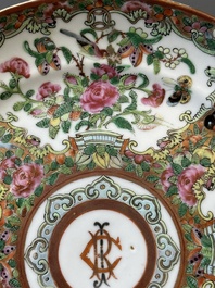 A pair of Chinese Canton famille rose monogrammed plates and a large '100 butterflies' tray, 19th C.