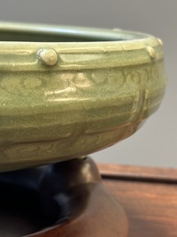 A Chinese Longquan celadon tripod censer on wooden stand, Yuan/Ming