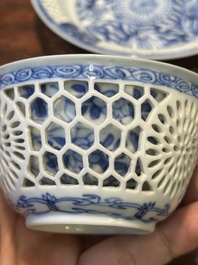 A Chinese blue and white reticulated double-walled cup and saucer, Kangxi
