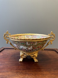 A Chinese Canton famille rose reticulated basket on stand and a bowl with gilt bronze mounts, 19th C.