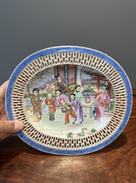 An oval Chinese Canton famille rose dish with a reticulated border, 19th C.