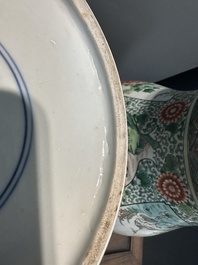A pair of Chinese famille verte 'bird and flower' vases and covers, Kangxi mark, 19th C.