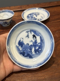 Four Chinese blue and white saucers and an 'erotic' cup, Kangxi