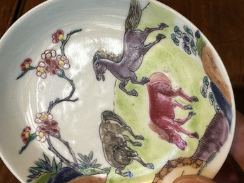 A pair of Chinese famille rose cups and saucers with horses, Yongzheng