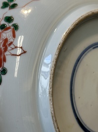 A Chinese famille verte 'qilin and falcon' plate, artemisia leaf mark, Kangxi