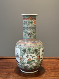 A Chinese famille verte covered vase and a bottle vase, 19th C.