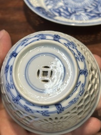A Chinese blue and white reticulated double-walled cup and saucer, Kangxi