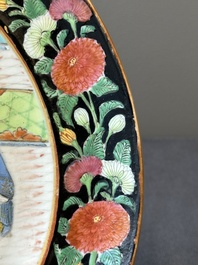 A pair of Chinese monogrammed Canton famille rose plates with black-glazed rims, 19th C.