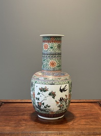 A Chinese famille verte covered vase and a bottle vase, 19th C.