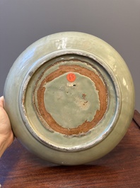 A Chinese Longquan celadon dish with floral anhua design, Ming