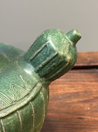 Two Chinese monochrome green-glazed stoneware 'dragon' vases and a kendi, Fujian kiln, late Ming
