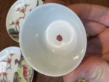 A pair of Chinese famille rose cups and saucers with horses, Yongzheng