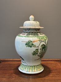 A Chinese famille verte covered vase and a bottle vase, 19th C.