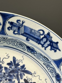 A Chinese blue and white 'antiquities' dish, Kangxi