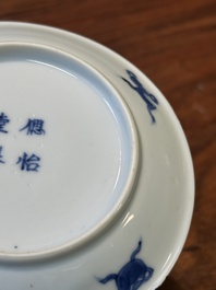Four Chinese blue and white saucers and an 'erotic' cup, Kangxi