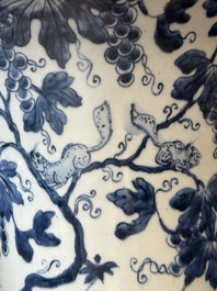 Two Chinese blue and white 'gu' vases with squirrels among grape vines, Kangxi