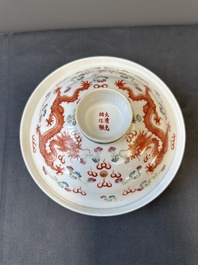 A Chinese famille rose bowl and cover with dragons chasing pearls, Guangxu mark, 19th C.