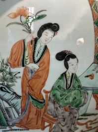 A Chinese famille verte covered vase and a bottle vase, 19th C.