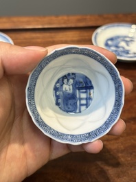 Four Chinese blue and white saucers and an 'erotic' cup, Kangxi