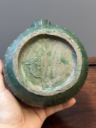 Two Chinese monochrome green-glazed stoneware 'dragon' vases and a kendi, Fujian kiln, late Ming