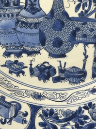 A Chinese blue and white 'antiquities' dish, Kangxi