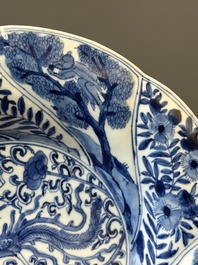 Four Chinese blue and white lobed 'phoenix and monkey' plates, flower mark, Kangxi