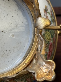 A Chinese Canton famille rose reticulated basket on stand and a bowl with gilt bronze mounts, 19th C.