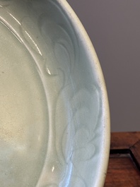 A Chinese Longquan celadon dish with floral anhua design, Ming
