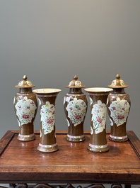A Chinese capucin-brown-ground famille rose garniture of five vases with floral design, Qianlong