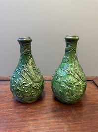 Two Chinese monochrome green-glazed stoneware 'dragon' vases and a kendi, Fujian kiln, late Ming