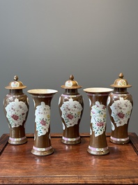 A Chinese capucin-brown-ground famille rose garniture of five vases with floral design, Qianlong