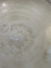 A Chinese Longquan celadon dish with floral anhua design, Ming