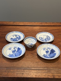 Four Chinese blue and white saucers and an 'erotic' cup, Kangxi