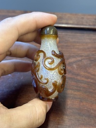 A rare Chinese brown-overlay white glass snuff bottle with chilong design, Qianlong/Jiaqing