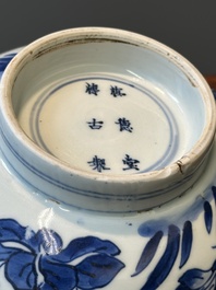 A Chinese blue and white 'birds among flowering branches' bowl, Shen De Tang Bo Gu Zhi 慎德堂博古製 mark, Kangxi