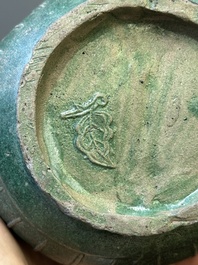 Two Chinese monochrome green-glazed stoneware 'dragon' vases and a kendi, Fujian kiln, late Ming