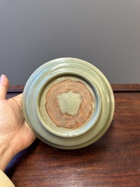 A Chinese Longquan celadon dish with floral anhua design, Ming