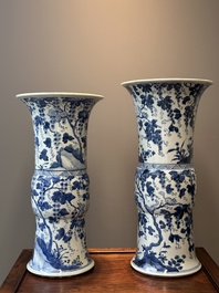 Two Chinese blue and white 'gu' vases with squirrels among grape vines, Kangxi