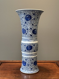 A Chinese blue and white 'chrysanthemum scroll' 'gu' vase, Kangxi