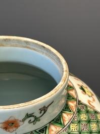 A Chinese famille verte covered vase and a bottle vase, 19th C.